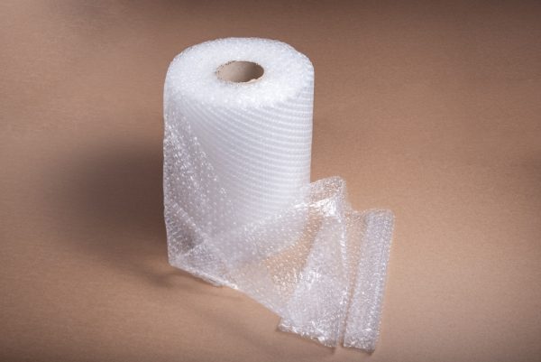 roll-bubble-film-brown-cardboard-background_181654-3204